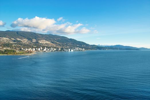 Sea near Vancouver Canada with city on the other bank