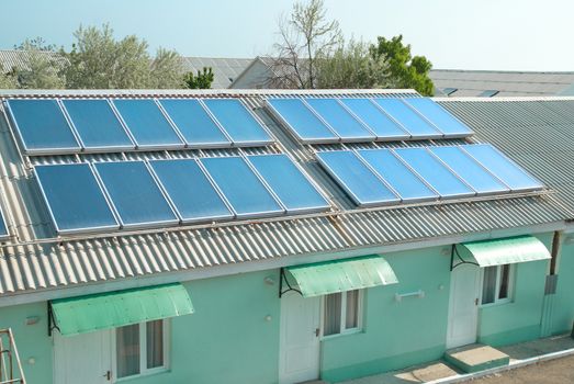 Solar water heating system on the red roof. Gelio panels.