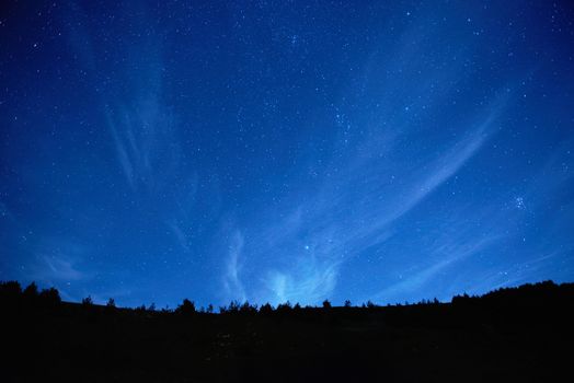 Blue dark night sky with many stars. Space background