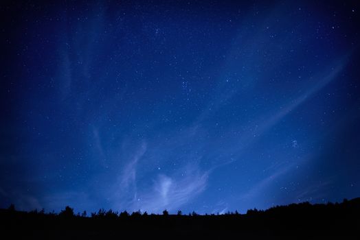 Blue dark night sky with many stars. Space background