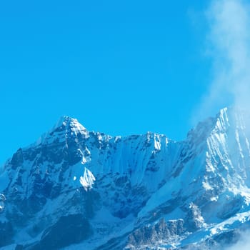 Top of High mountains, covered by snow. Kangchenjunga, India.