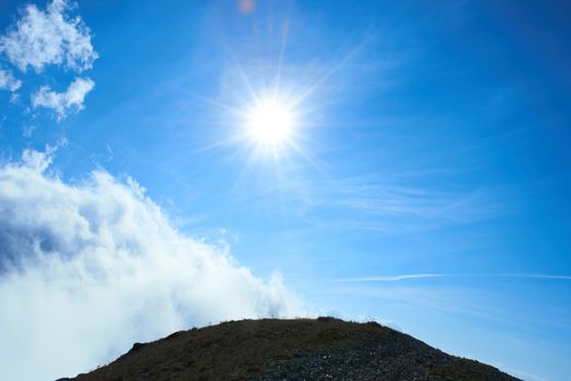 Beautiful blue sky with sun and clouds