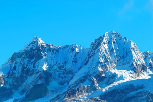 Top of High mountains, covered by snow. Kangchenjunga, India.