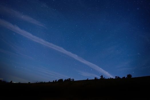 Blue dark night sky with many stars. Space background