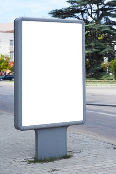 Vertical blank billboard on the city street