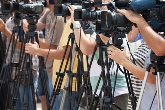 Press  conference. Covering an media event with a video camera.