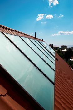 Solar panels (geliosystem) on the house roof.