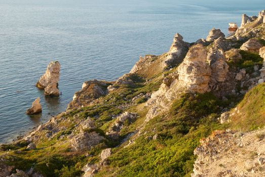 A coastline with many big rocks.