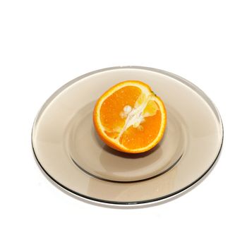 Orange segments on the plate isolated on white.