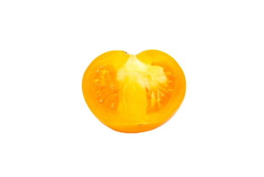 A half of fresh yellow tomato isolated on white.