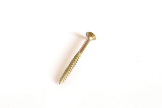 Golden screw on white background.