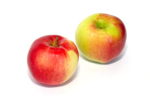 Two red fresh apples isolated on white.