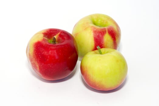 Three fresh apples isolated on white.