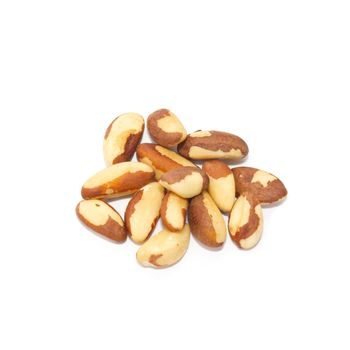 Heap of brazil nuts isolated on white.