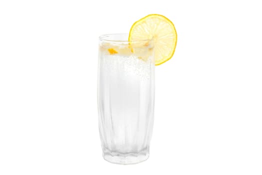 A cold water glass with lemon isolated on white.