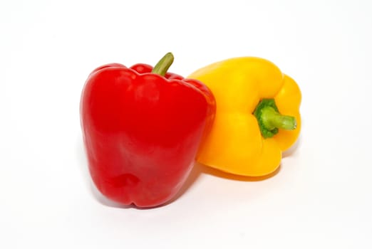 Red and yellow paprika isolated on white.