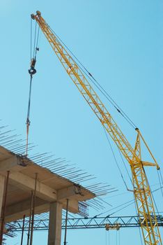 Building crane and the building under construction.