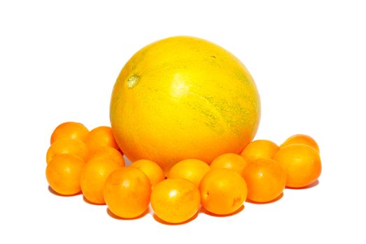 Yellow plums and the melon isolated on white.