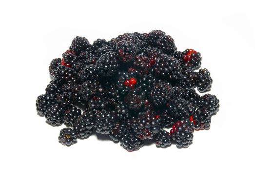 Pile of fresh blackberries isolated on white.