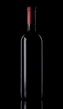 Elegant bottle of red wine on black background