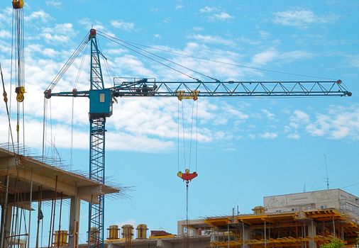 Building crane and the building under construction.