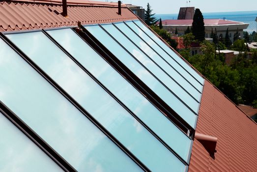 Solar panels (geliosystem) on the house roof.