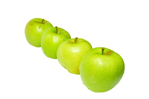 Row of green apples isolated on white.