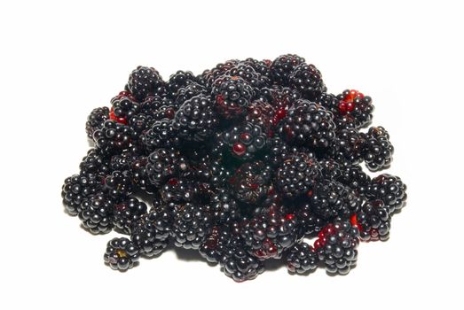 Pile of fresh blackberries isolated on white.