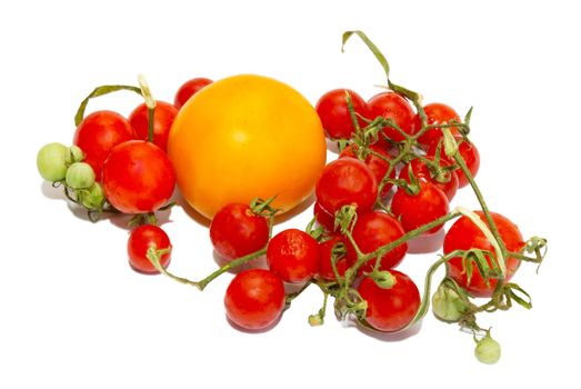 Red small tomatoes isolated on white.