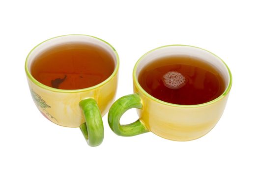 Two teacups with tea isolated on white.