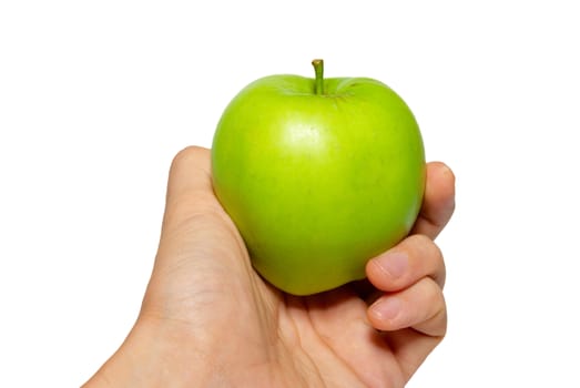 Green tasty apple in a hand isolated on white.