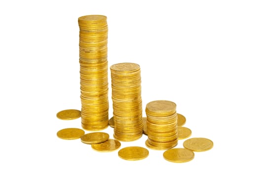 Stacks of golden coins isolated on white.