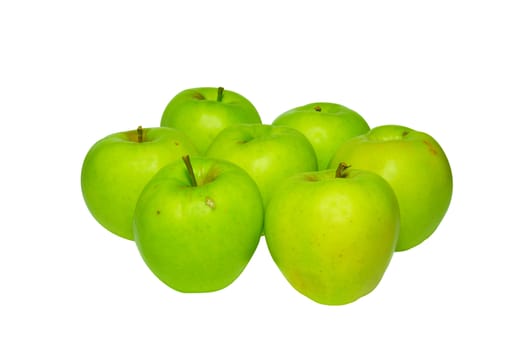 Stack of green apples isolated on white.