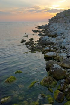 Sunset on the sea with the waves.