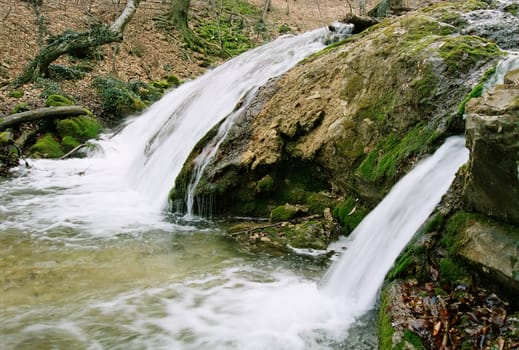 Rapid mountain river in the autumn forest.