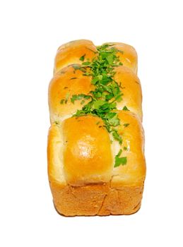 Golden fresh bread with greens isolated on white.