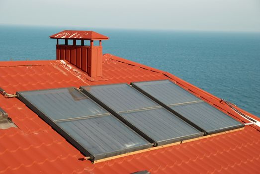 Alternative energy- solar system on the house roof.
