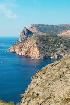 Sea landscape with rocks and tower.