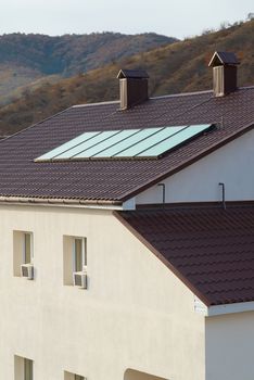 Solar panel (geliosystem) on the house roof.