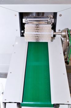 The conveyor at the plant for the production of soap