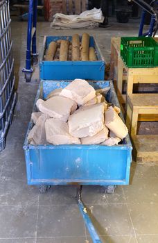 Metal trolley with soap and indoor plant for the production of soap