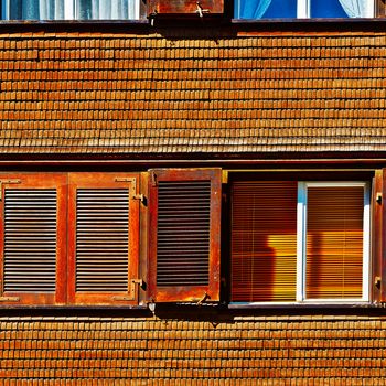 The Window on the Facade of Wooden House in Switzerland