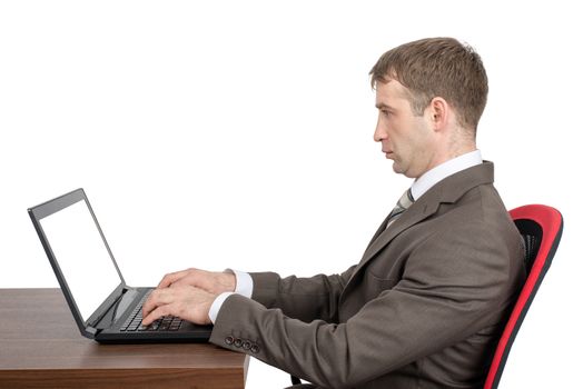 Businessman working on laptop with blank screen isolated on white background