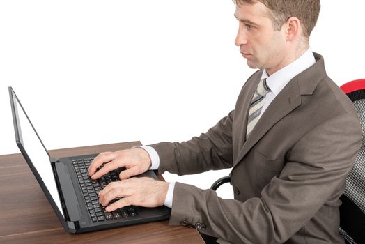 Businessman working on laptop at table isolated on white background