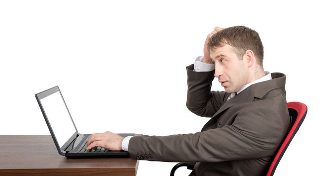 Thinking businessman working on laptop with blank screen isolated on white background