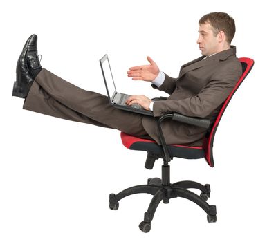 Businessman sitting on chair with laptop and legs up isolated on white background, side view