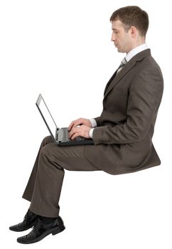 Businessman working on laptop isolated on white background