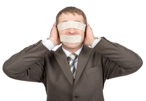 Businessman with tape over his eyes and mouth, closed ears isolated on white background