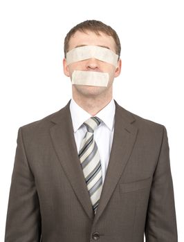 Businessman with tape over his eyes and mouth isolated on white background