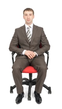 Businessman sitting on chair and looking at camera isolated on white background, front view